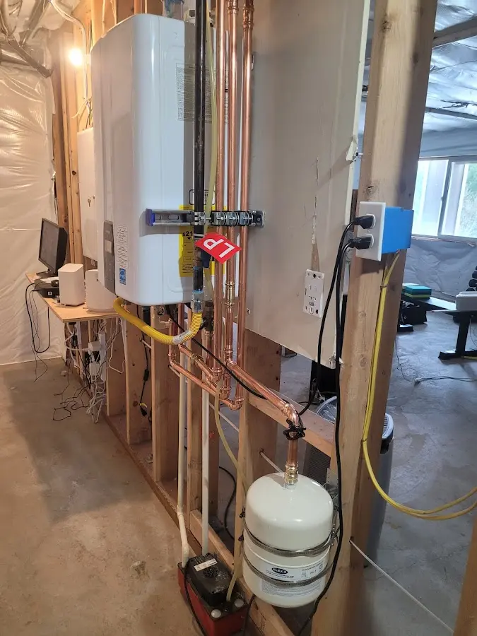 Licensed plumber repairing a kitchen sink in Campton